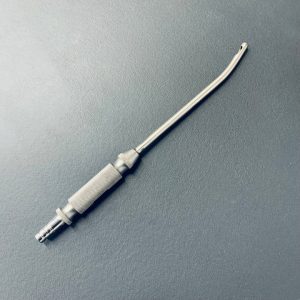 A close-up image showing the Toledo V Dissecting Fat Injection Cannula, highlighting its design and application in medical procedures.